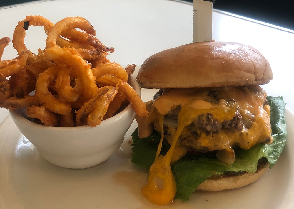 Bacon cheeseburger and zweibel fries at Snug Harbor